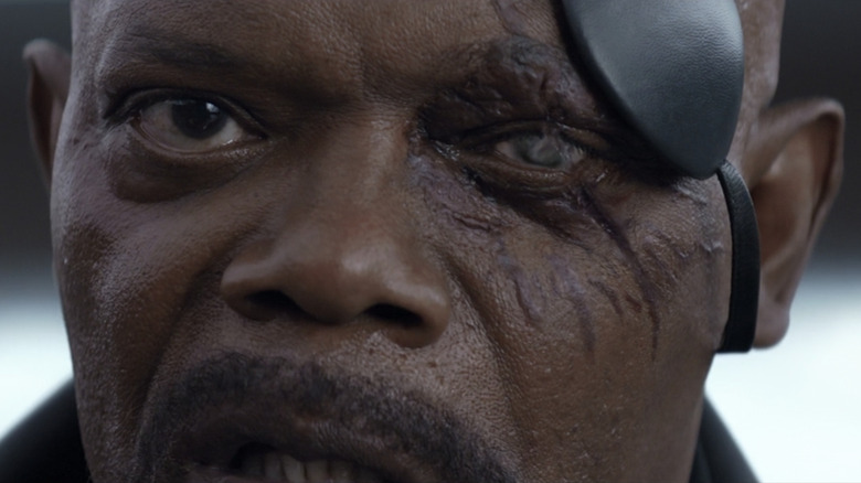 Nick Fury removes eyepatch 