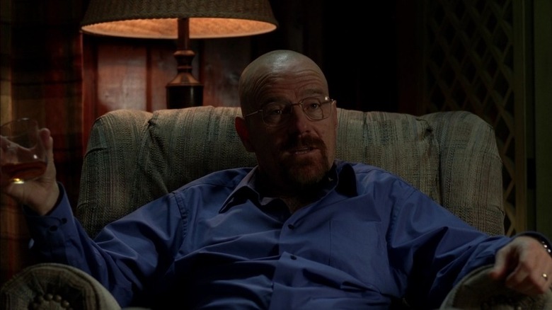 Walter White leans back in chair