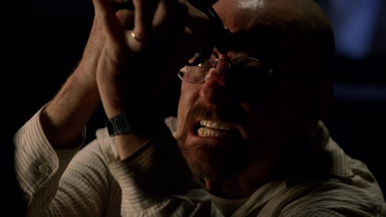 Walter White holds Jesse Pinkman's gun to his head