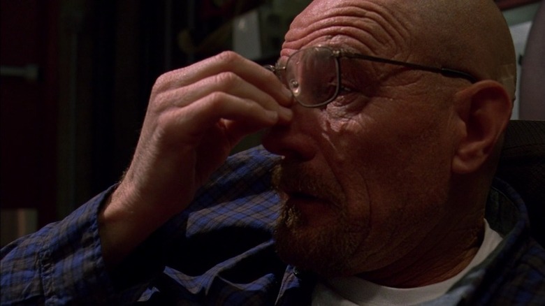 Walter White adjusts glasses