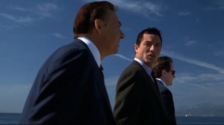 Briscoe and Curtis walk along the Los Angeles beach