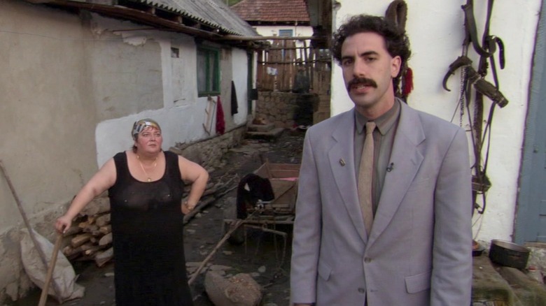Borat standing by his wife