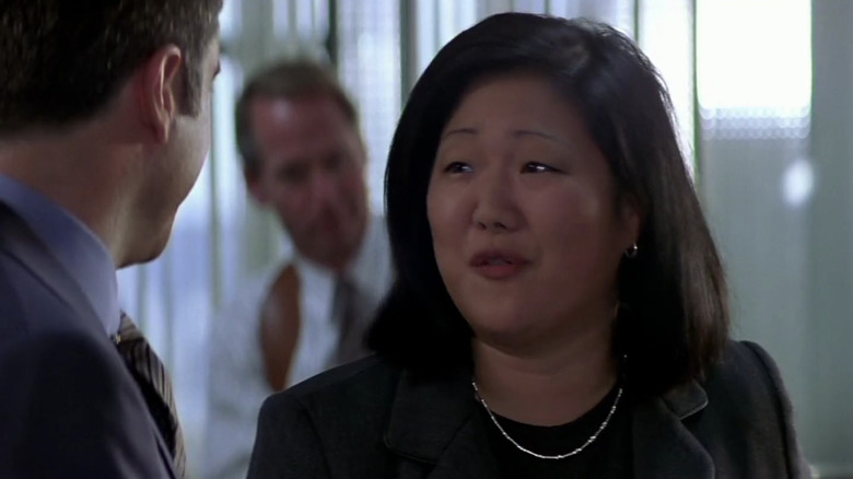 Margaret Cho in a black suit in an office