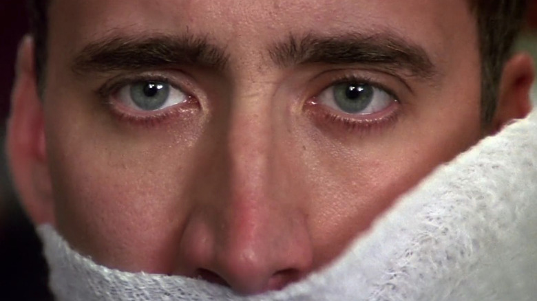 Nicolas Cage has bandages taken off his face