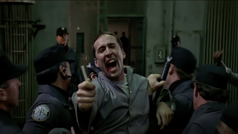 Nicolas Cage carried away by prison guards