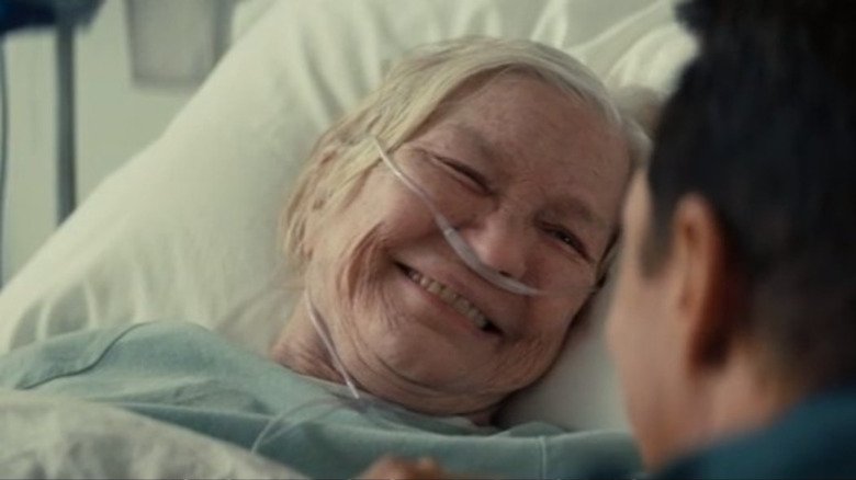 Murphy smiles at Coop in a hospital bed