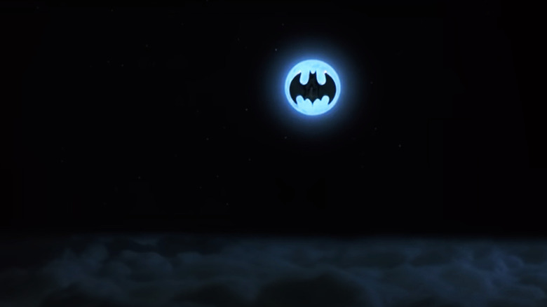 The moon frames the Bat-plane