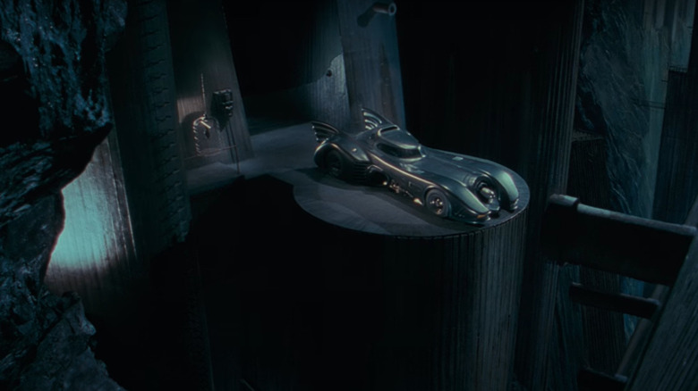 Batman in his cave with his car