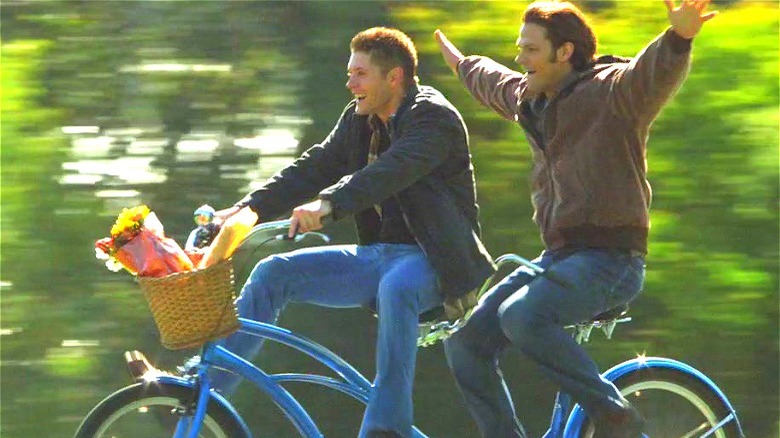 Sam and Dean ride a bike