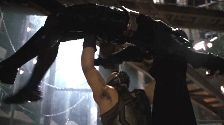 Bane lifts Batman overhead