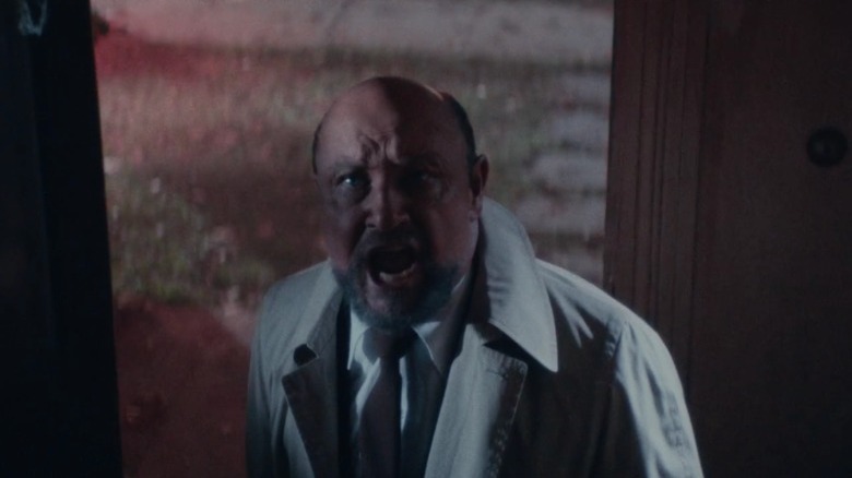 Loomis shouting in a doorway