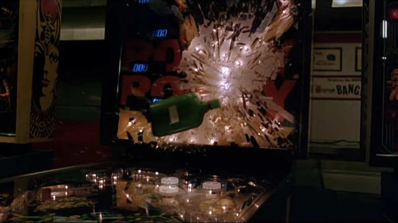 A bottle breaking a Rocky pinball machine in "Rocky III"