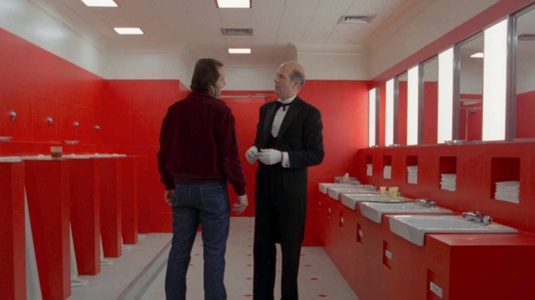 two men in a red bathroon