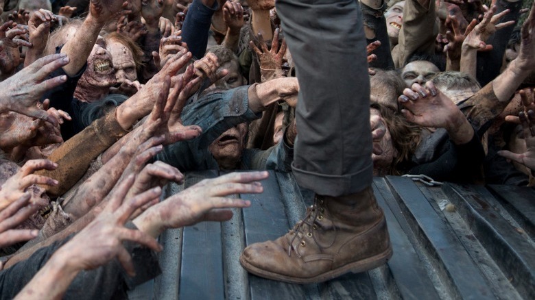 Walkers reaching for Glenn's ankle