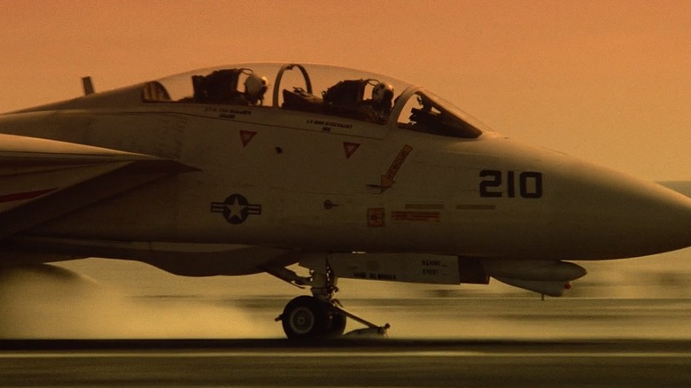 Jet landing on aircraft carrier