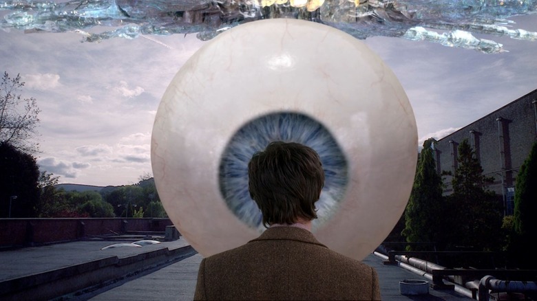 The Eleventh Doctor staring down a huge alien eyeball