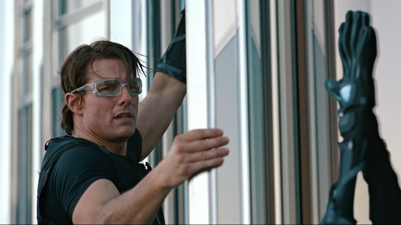 Ethan Hunt climbs building