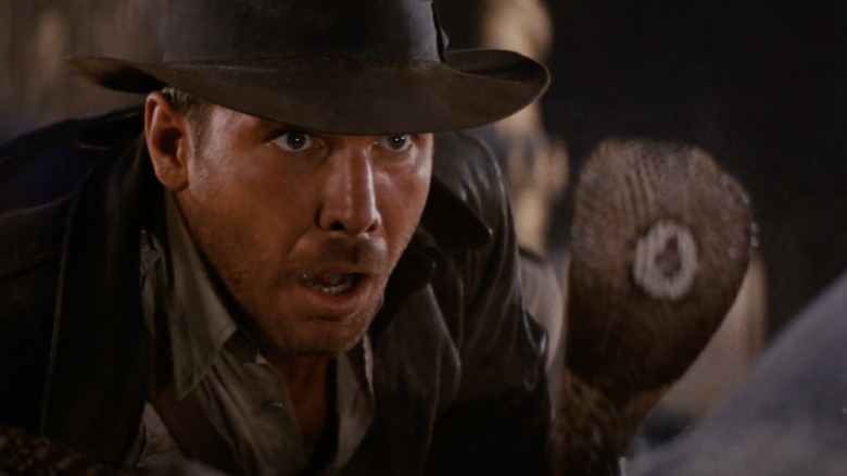 Indiana Jones stares down a cobra in Raiders of the Lost Ark