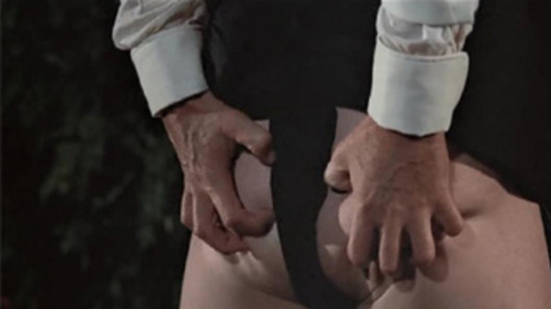 Bond grabs a sumo by the buttocks