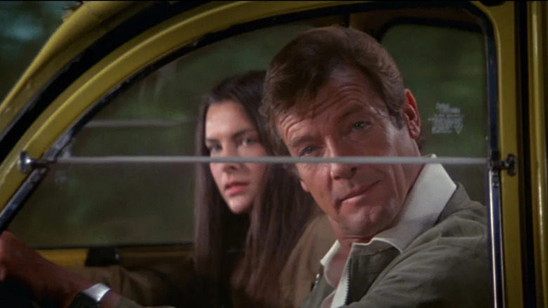 Bond and Melina glance at pursuers