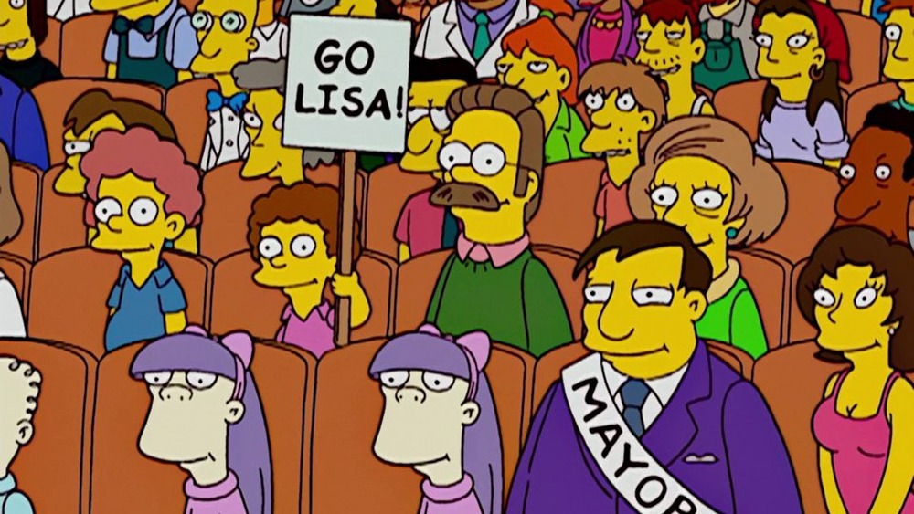 Ned Flanders and Edna Krabappel cheer on Lisa in "I'm Spelling as Fast as I Can" on The Simpsons