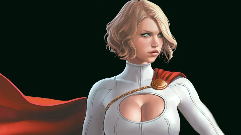 Power Girl standing before black background looking to the left