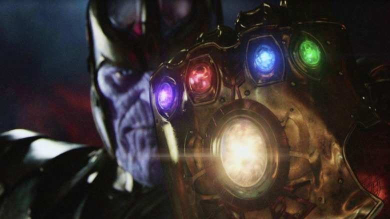 Thanos holds up the Infinity Gauntlet