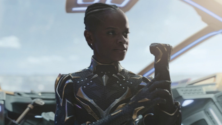 Black Panther pressing her suit button