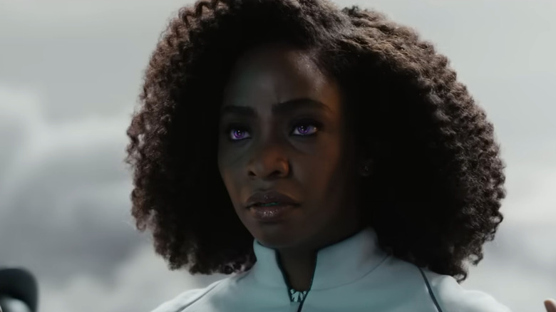 Monica Rambeau stares with her eyes glowing purple