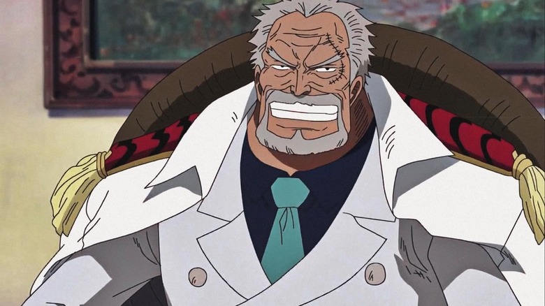 Garp grins wearing white suit