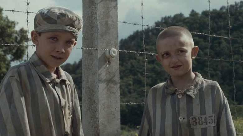 Bruno and Shmuel dressed in prisoner's uniform