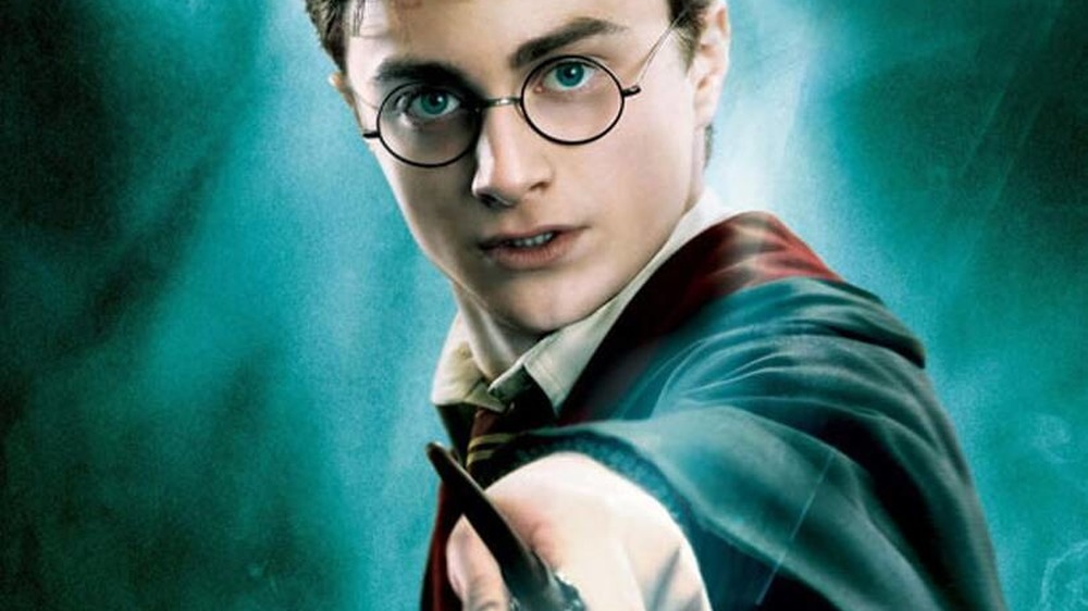 Harry Potter brandishing a wand