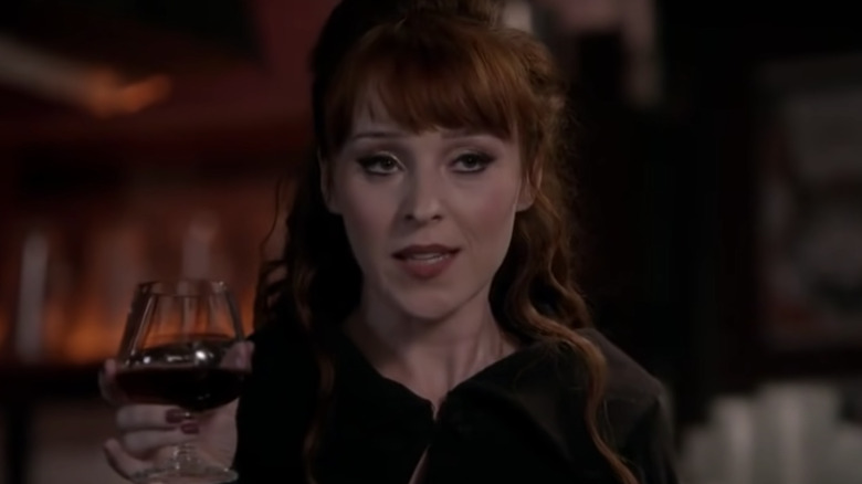 Rowena holding wine