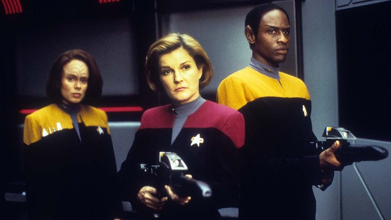 Janeway, Tuvok, and Torres stand ready