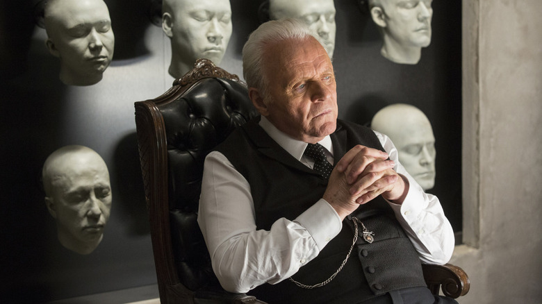 Anthony Hopkins sits in a chair