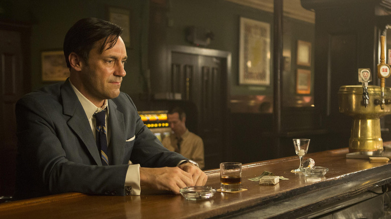 Jon Hamm sitting in a bar