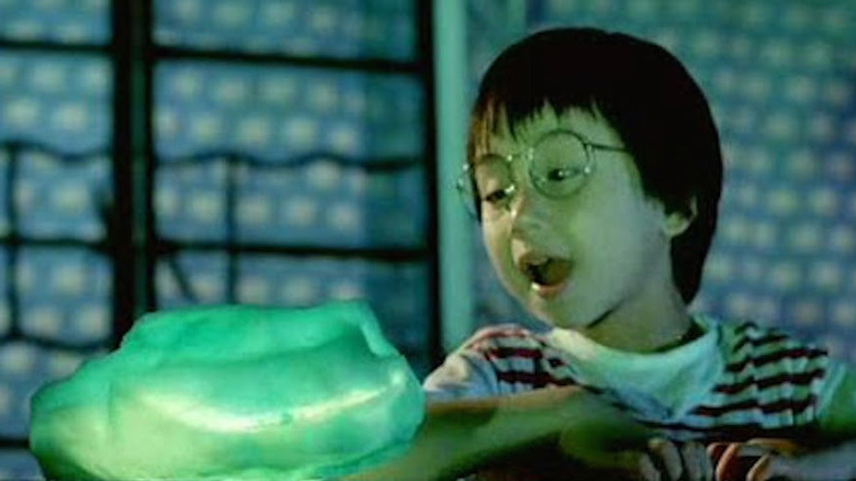 Bin-Bin Siu reacts in wonder to the Magic Crystal