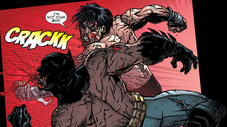 Nightwing punching Batman