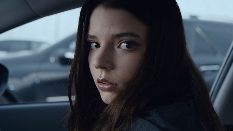 Girl in car looks worried