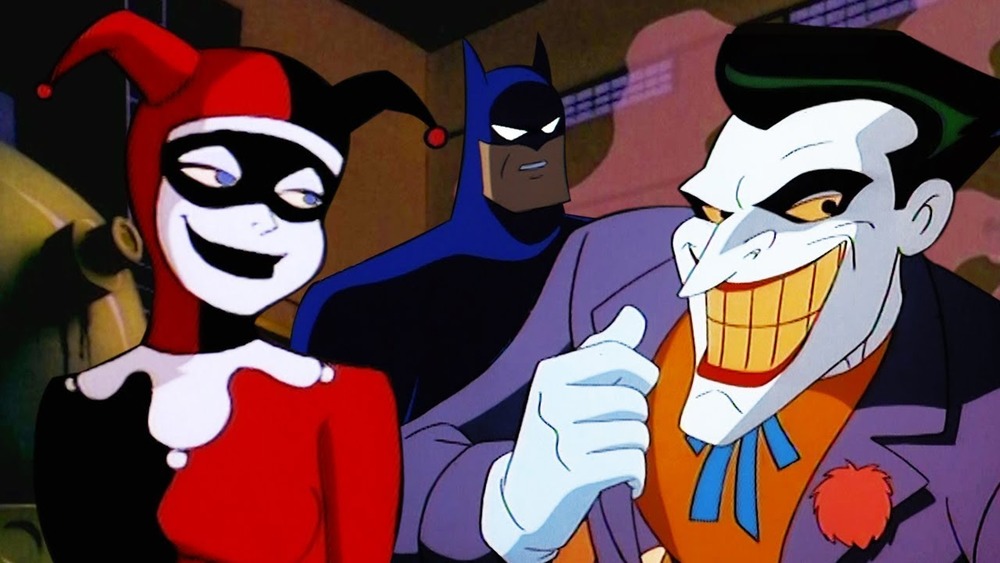 Harley Quinn and the Joker smile as Batman looks on in Batman: The Animated Series