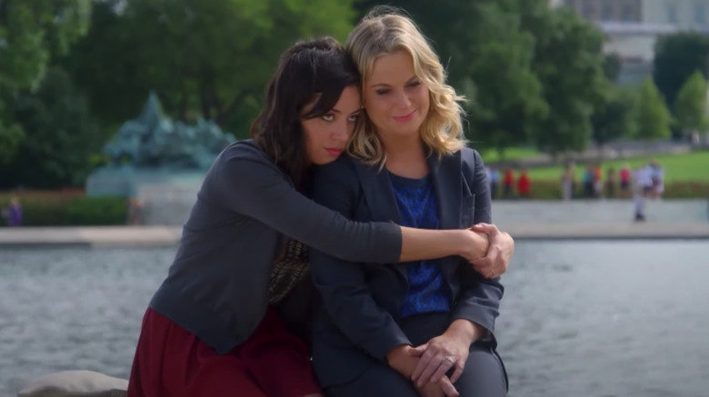 April Ludgate hugging Leslie Knope