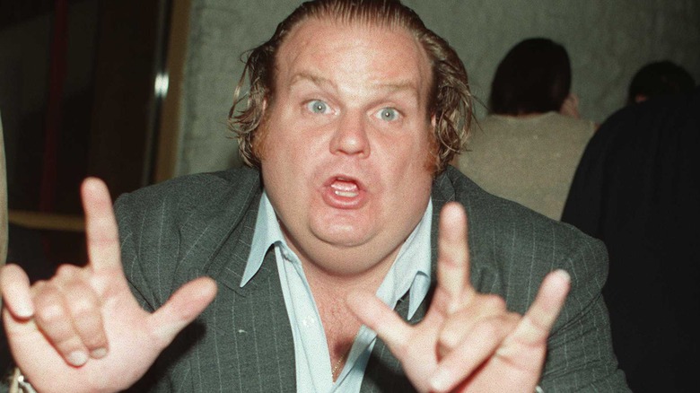 Chris Farley holding up hands