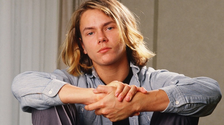 River Phoenix hands locked