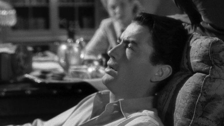 Gregory Peck reclines on a therapist's couch