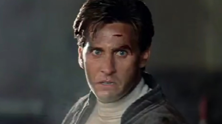 Emilio Estevez scowling