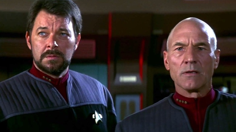 Picard standing with Riker