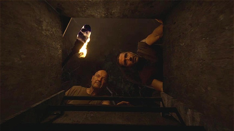 Lost Jack and Locke look into the hatch