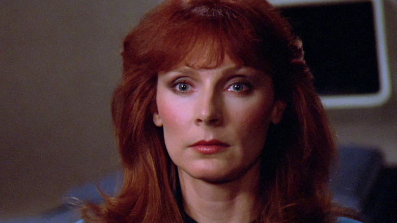 Dr Crusher looks left