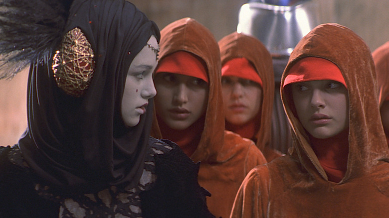 Queen Amidala looks at her handmaidens