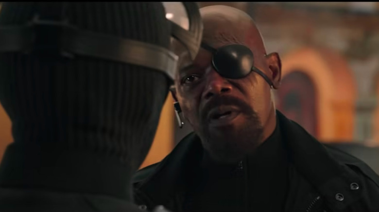 An unamused Nick Fury speaks to Spider-Man in Far From Home